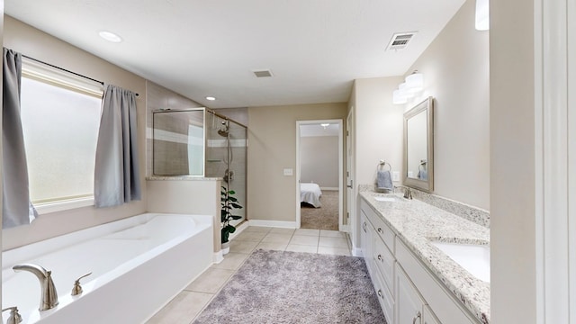 bathroom featuring visible vents, a sink, a shower stall, tile patterned flooring, and a garden tub