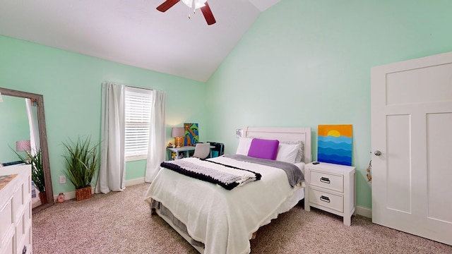 bedroom featuring light colored carpet, vaulted ceiling, and baseboards