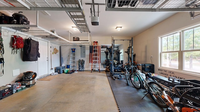 garage featuring electric panel and a garage door opener
