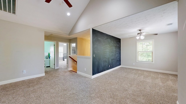 spare room with a ceiling fan, baseboards, carpet flooring, and visible vents
