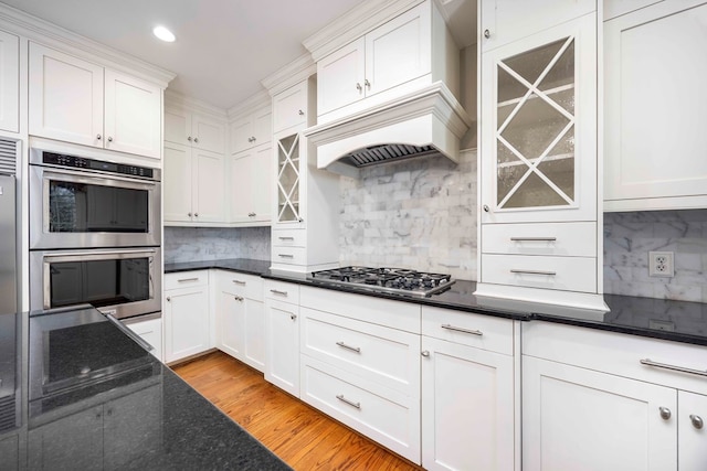 kitchen featuring white cabinetry, appliances with stainless steel finishes, and light hardwood / wood-style floors