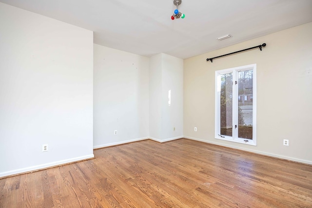 empty room with light wood-type flooring