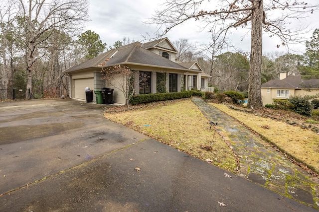 view of side of property with a garage