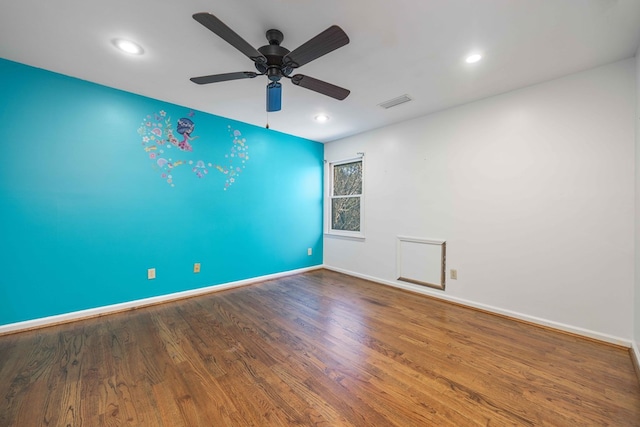 unfurnished room with ceiling fan and hardwood / wood-style floors