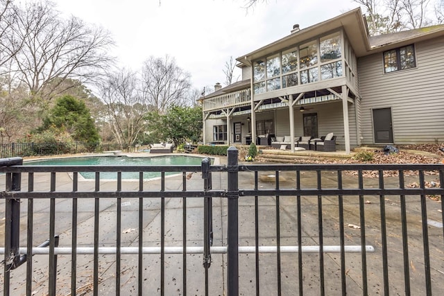 exterior space featuring an outdoor hangout area and a patio area