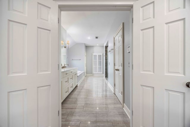 bathroom featuring lofted ceiling, vanity, and shower with separate bathtub