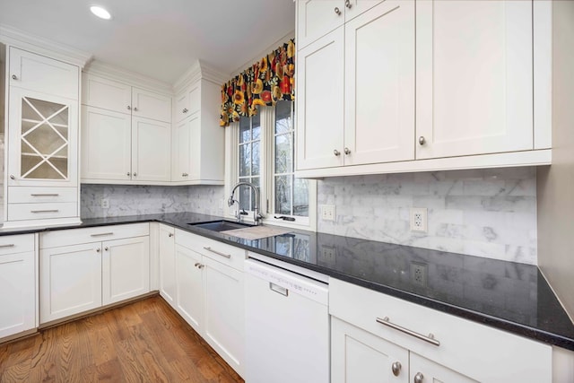 kitchen with white cabinetry, sink, backsplash, and white dishwasher