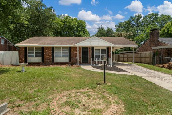1918 Watkins Dr, Columbus, GA 31907 - view of front of property with driveway, a carport, and brick siding