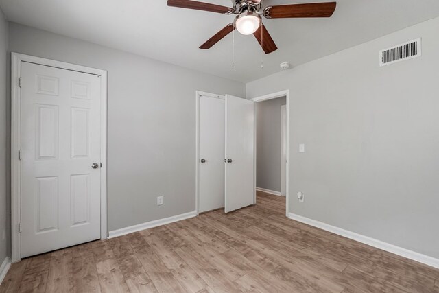 1918 Watkins Dr, Columbus, GA 31907 - unfurnished bedroom with light wood-type flooring, baseboards, and a ceiling fan