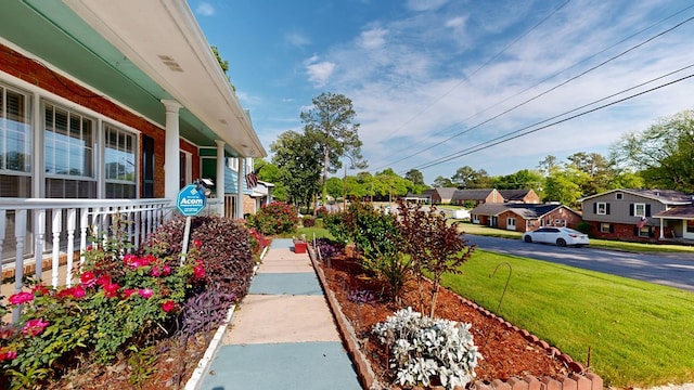 2323 Devonshire Dr, Columbus, GA 31904 - view of grassy yard featuring covered porch and a residential view
