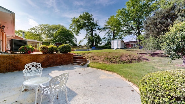 2323 Devonshire Dr, Columbus, GA 31904 - view of patio with cooling unit, a shed, and an outbuilding