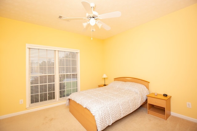 bedroom with carpet, ceiling fan, and a textured ceiling