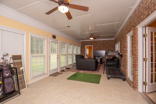 sunroom featuring ceiling fan