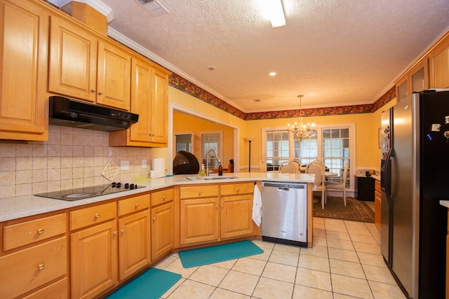 kitchen featuring an inviting chandelier, crown molding, sink, appliances with stainless steel finishes, and kitchen peninsula