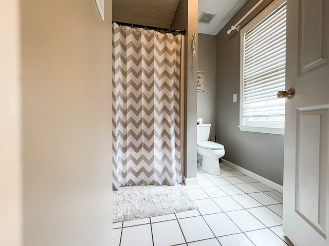4880 Turnberry Ln, Columbus, GA 31909 - full bath featuring curtained shower, tile patterned floors, and a textured ceiling