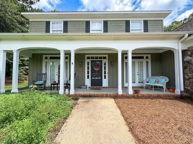 4880 Turnberry Ln, Columbus, GA 31909 - view of front of house with french doors, board and batten siding, and a porch