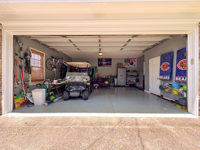 4880 Turnberry Ln, Columbus, GA 31909 - garage with baseboards and a garage door opener