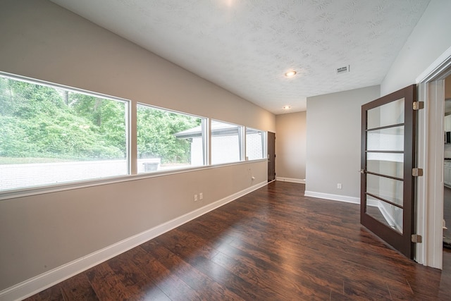 2027 Preston Dr, Columbus, GA 31906 - spare room with baseboards, wood finished floors, recessed lighting, and a textured ceiling