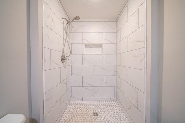 2027 Preston Dr, Columbus, GA 31906 - full bathroom featuring a stall shower, toilet, and a textured ceiling