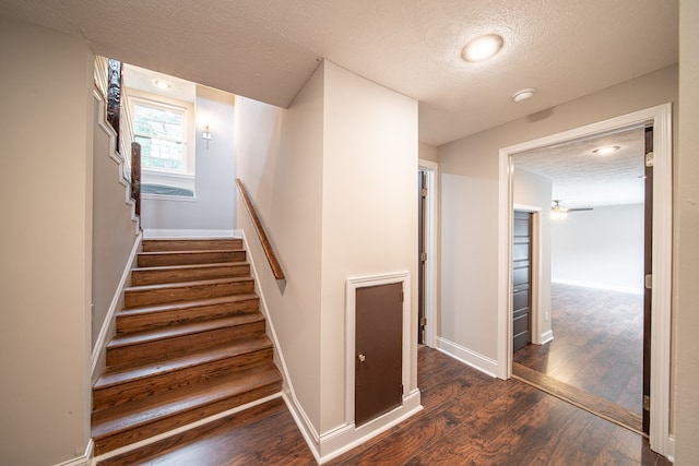 2027 Preston Dr, Columbus, GA 31906 - stairway with a textured ceiling, wood finished floors, baseboards, and a ceiling fan