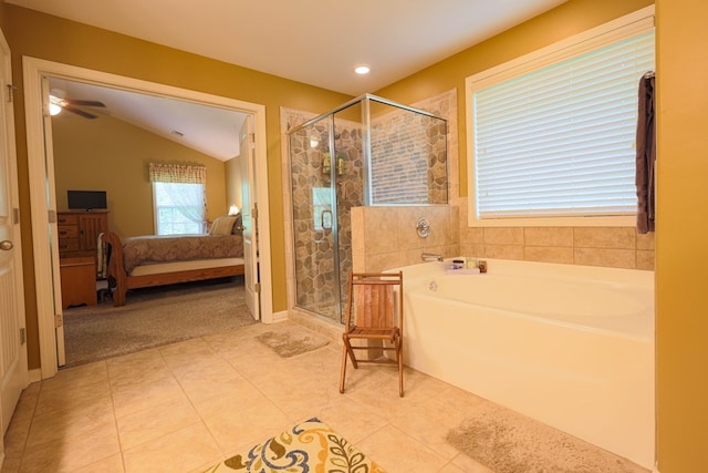 ensuite bathroom with a garden tub, a stall shower, tile patterned floors, lofted ceiling, and ensuite bathroom