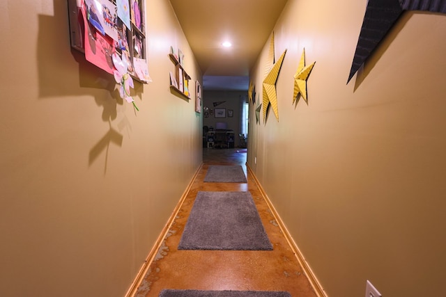 corridor with baseboards and recessed lighting