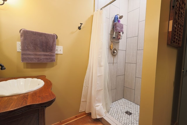 bathroom with a sink and a shower stall