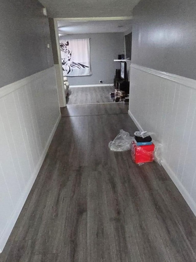 corridor with dark wood-type flooring