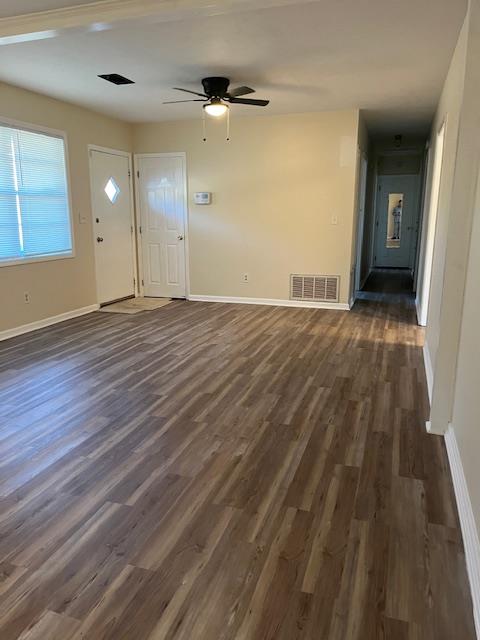 foyer entrance with dark hardwood / wood-style floors and ceiling fan