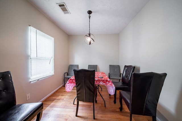 1605 39th St, Columbus, GA 31904 - dining area with light wood finished floors and a textured ceiling
