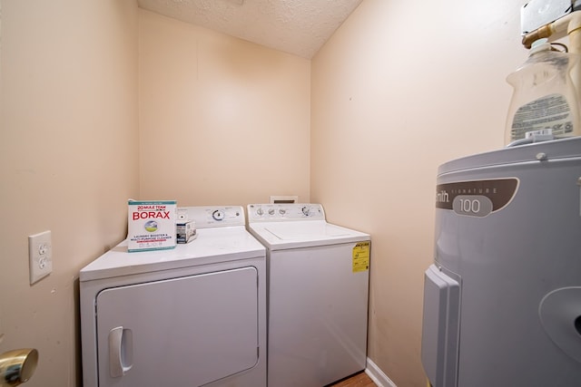 1605 39th St, Columbus, GA 31904 - laundry area featuring washer and dryer and a textured ceiling
