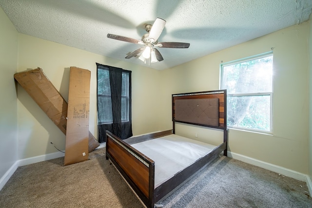 1605 39th St, Columbus, GA 31904 - carpeted bedroom featuring a textured ceiling and ceiling fan