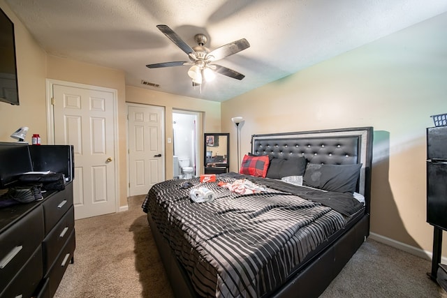 1605 39th St, Columbus, GA 31904 - carpeted bedroom with ceiling fan and connected bathroom