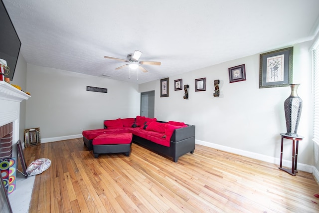 1605 39th St, Columbus, GA 31904 - living room with hardwood / wood-style flooring, a ceiling fan, and a fireplace