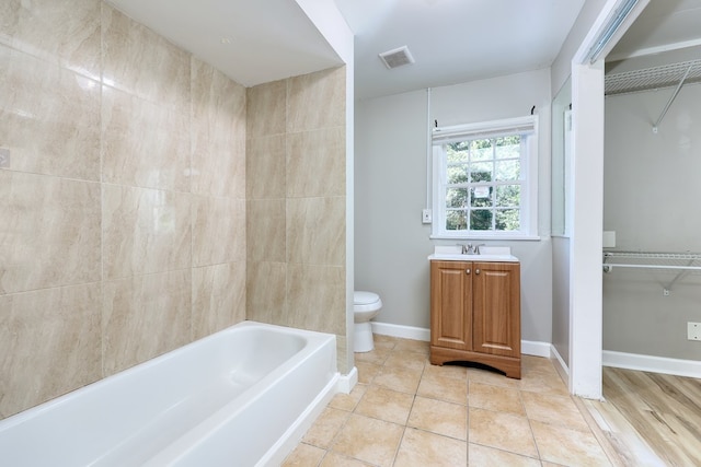 3775 Steam Mill Rd, Columbus, GA 31906 - full bathroom featuring vanity, bathing tub / shower combination, a walk in closet, and tile patterned floors