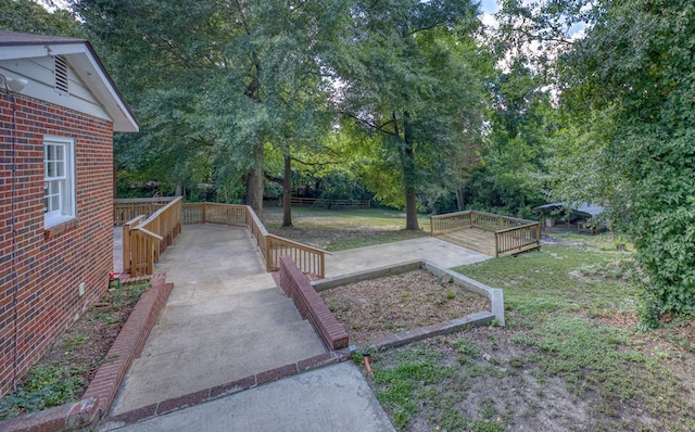 3775 Steam Mill Rd, Columbus, GA 31906 - view of green lawn with a vegetable garden and view of wooded area