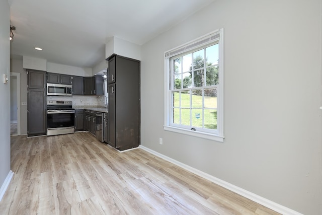 3775 Steam Mill Rd, Columbus, GA 31906 - kitchen featuring appliances with stainless steel finishes, plenty of natural light, light wood finished floors, and tasteful backsplash