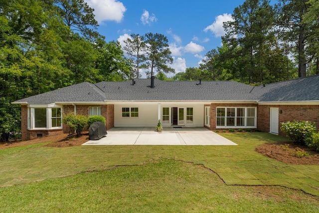 1425 Dartmouth Rd, Columbus, GA 31904 - back of property with a patio area, brick siding, a yard, and roof with shingles