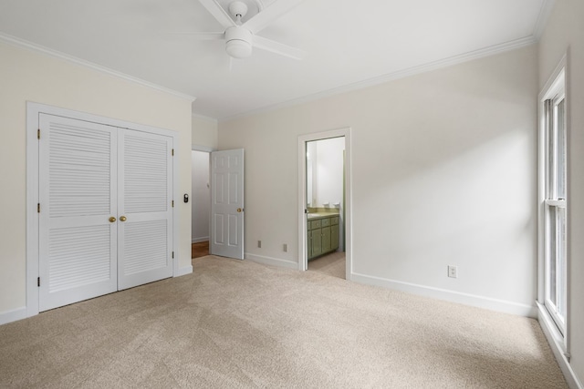 1425 Dartmouth Rd, Columbus, GA 31904 - unfurnished bedroom with light colored carpet, ornamental molding, baseboards, a closet, and ensuite bathroom