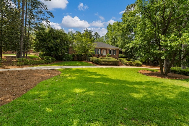 1425 Dartmouth Rd, Columbus, GA 31904 - view of front of house featuring brick siding and a front lawn