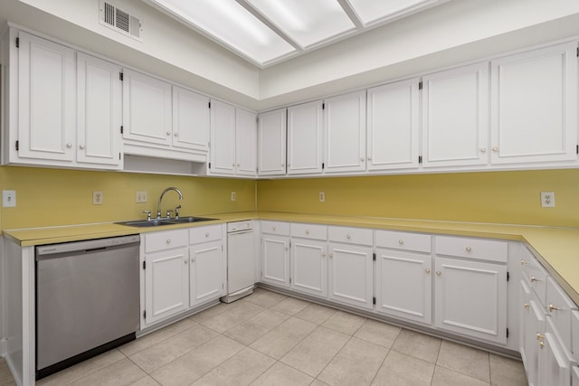 1425 Dartmouth Rd, Columbus, GA 31904 - kitchen featuring stainless steel dishwasher, a sink, white cabinets, light tile patterned flooring, and light countertops