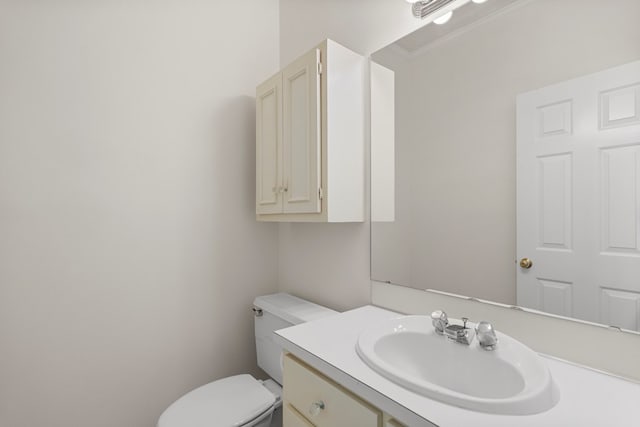 1425 Dartmouth Rd, Columbus, GA 31904 - half bath featuring vanity, toilet, and ornamental molding