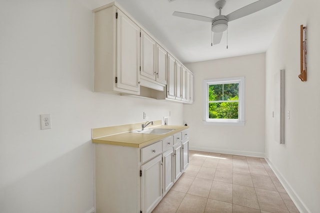1425 Dartmouth Rd, Columbus, GA 31904 - laundry area featuring hookup for a washing machine, cabinet space, baseboards, ceiling fan, and light tile patterned floors