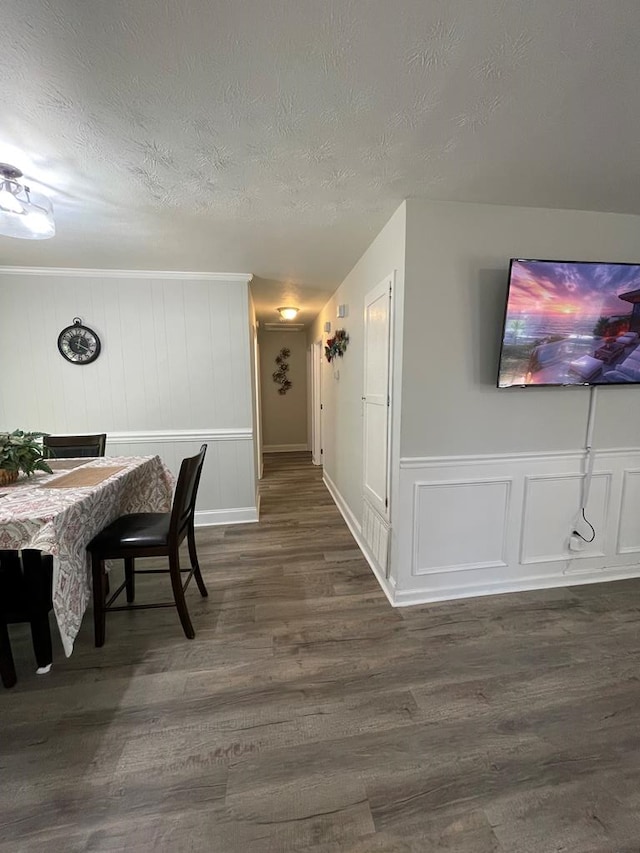 1023 Maridele Dr, Columbus, GA 31904 - dining space featuring a decorative wall, dark wood-style floors, and a textured ceiling
