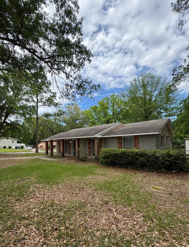 1023 Maridele Dr, Columbus, GA 31904 - ranch-style house featuring a front yard and brick siding