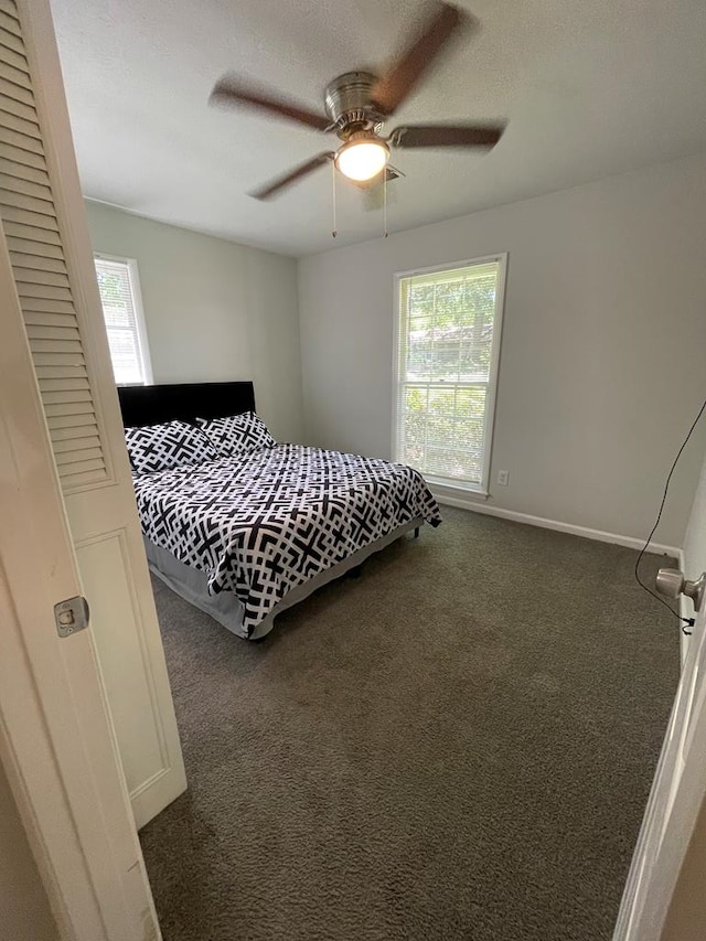1023 Maridele Dr, Columbus, GA 31904 - carpeted bedroom with multiple windows, ceiling fan, and baseboards