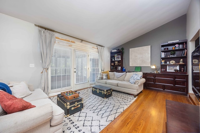 2618 Habersham Ave, Columbus, GA 31906 - living room featuring vaulted ceiling and wood finished floors