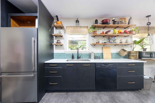 2618 Habersham Ave, Columbus, GA 31906 - kitchen featuring appliances with stainless steel finishes, open shelves, decorative backsplash, light countertops, and light wood finished floors