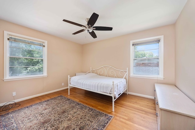 2618 Habersham Ave, Columbus, GA 31906 - bedroom with multiple windows, light wood-style flooring, and a ceiling fan