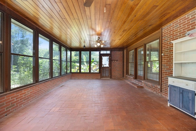 2618 Habersham Ave, Columbus, GA 31906 - unfurnished sunroom featuring a ceiling fan, brick wall, wood ceiling, brick floors, and healthy amount of natural light